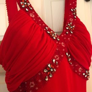 Pronovias red evening gown with embellishment.